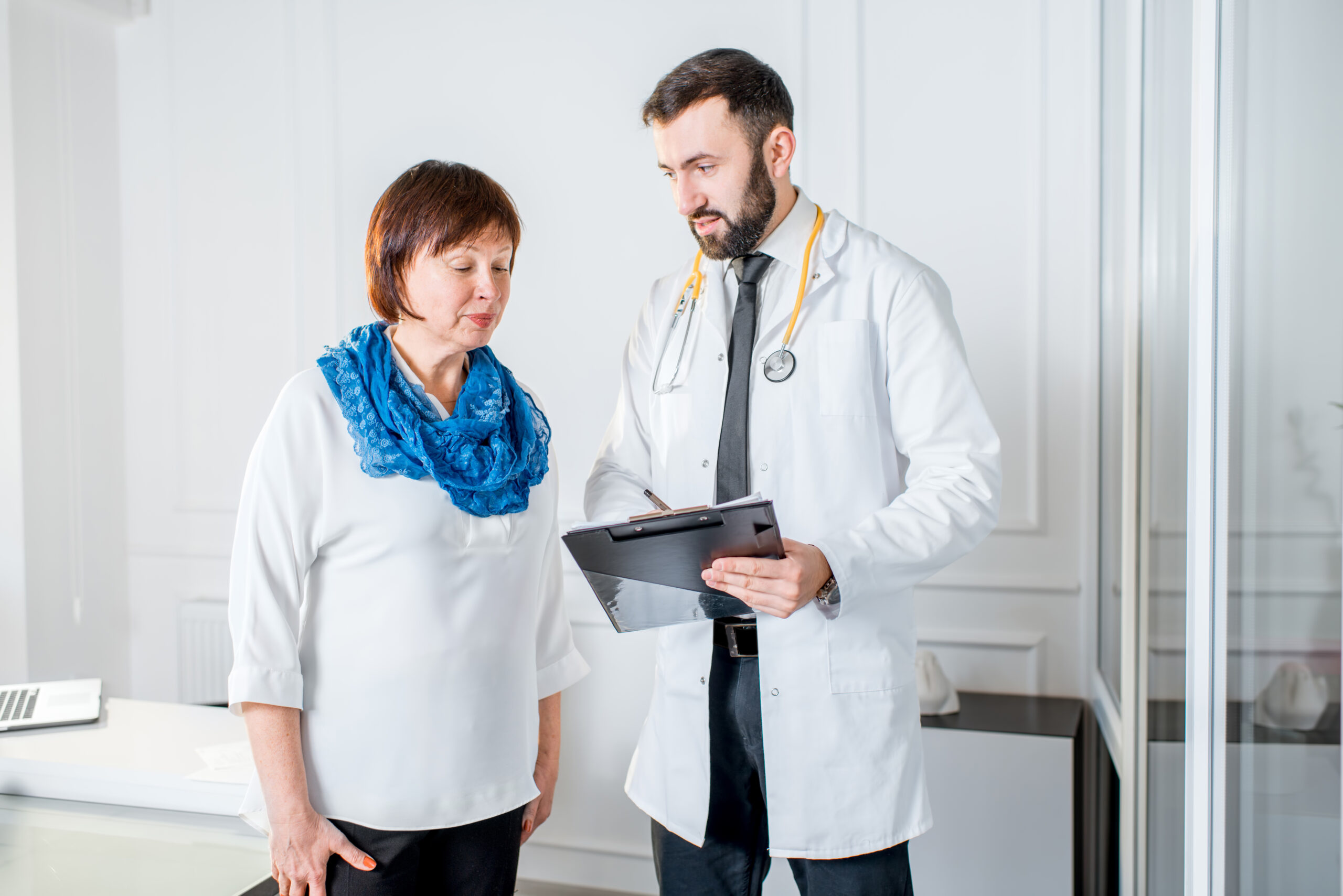 Older woman with doctor in the office